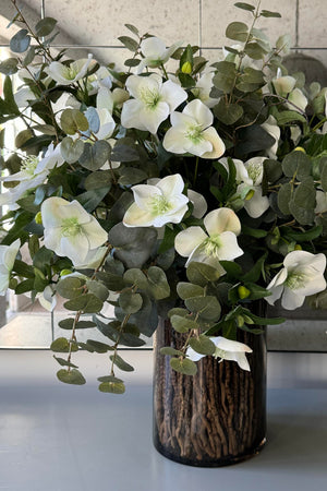 Hellebores, Eucalyptus and Twig in a Black Glass Vase