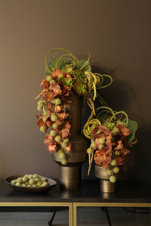 Orchids with Pompoms and Succulents in an Antique Gold Vase