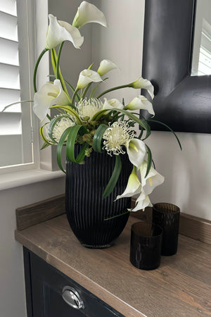 Calla Lily and Protea n a Black Ridged Vase