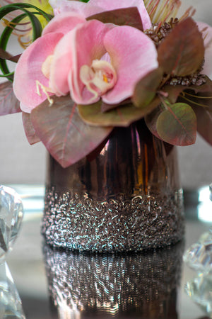 Orchid, Protea and Foliage in a Bronze Vase