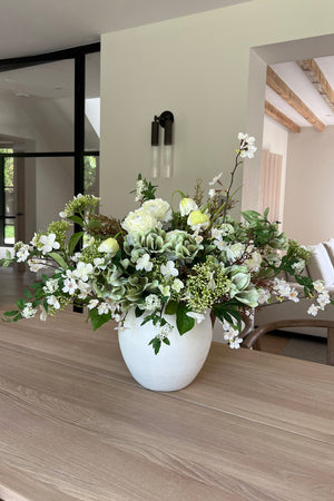 Ranunculus, Hellebores, Blossom  and Hydrangea in a White Stone Vase