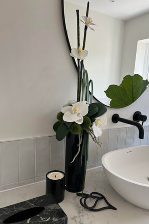 Orchid and Dianthus in Tall Black Glass Cylinder