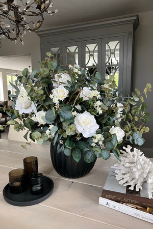 Eucalyptus, Astrantia and  Roses in an Opaque Glass Vase