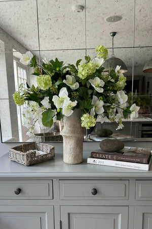 Hydrangea Spray, Hellebore, Ivy and Guelder Rose in a Stone Vase