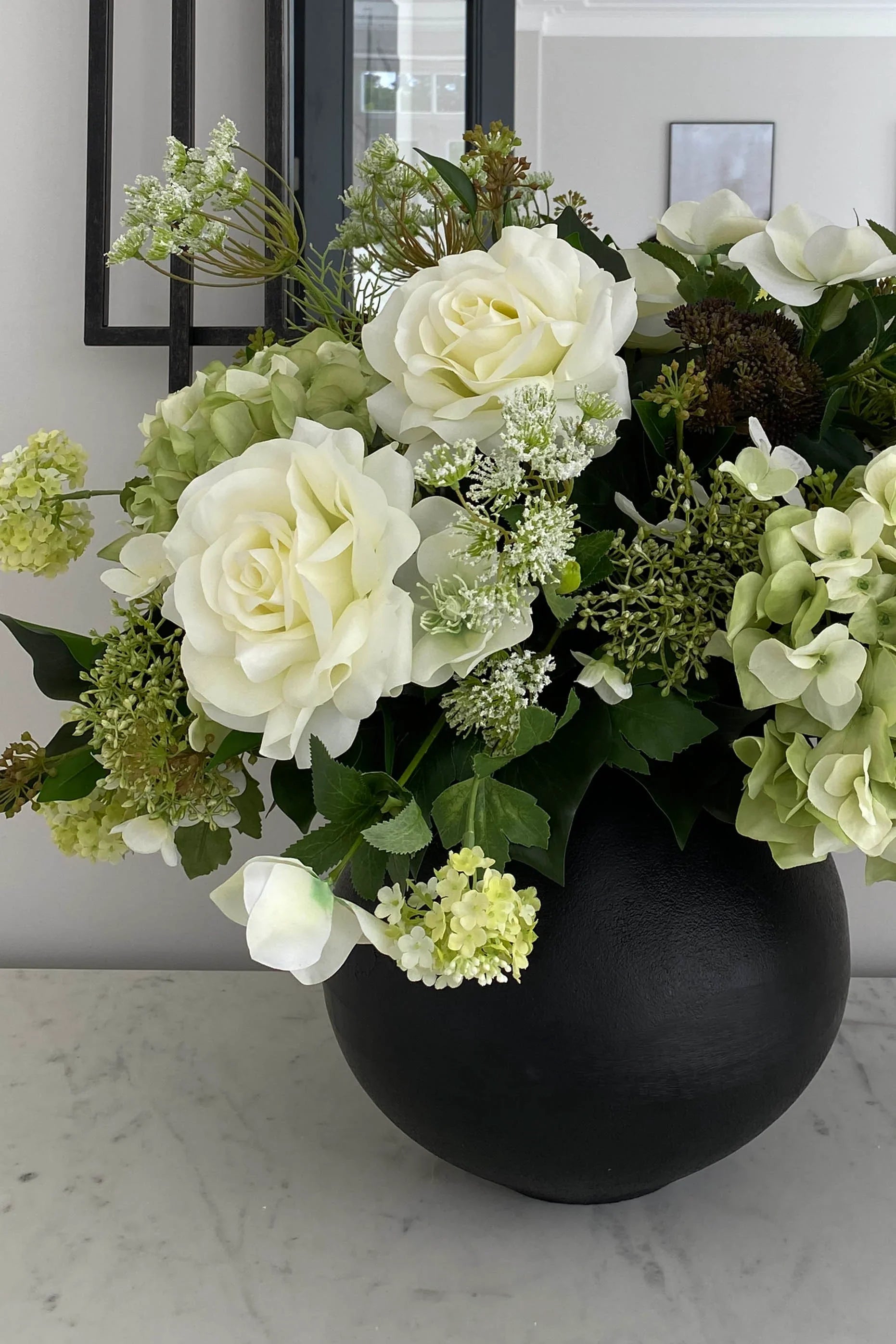 Hellebores, Roses and Snowball in a Black Metal Vase RTfact Flowers 