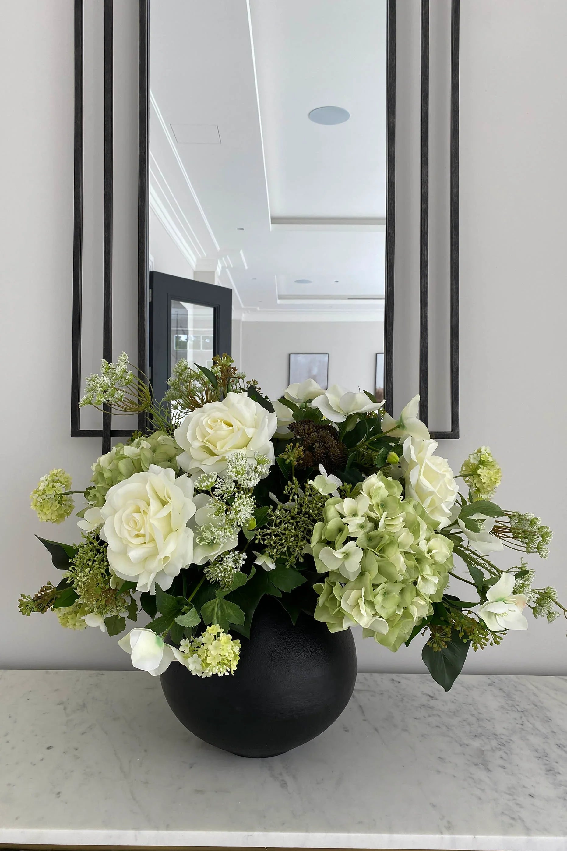 Hellebores, Roses and Snowball in a Black Metal Vase RTfact Flowers 