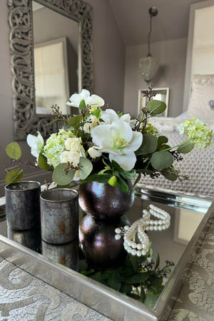 Hellebores, Hydrangea and Guelder Rose in a Bronze Glass Vase