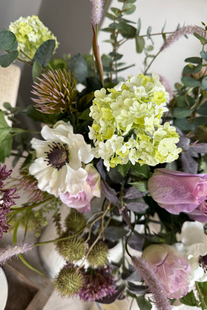 Eucalyptus, Sedum, Anemone and Roses in a Glazed Vase