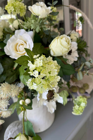 Eucalyptus, Anemones, Roses and Scabiosa in a Glazed White Vase