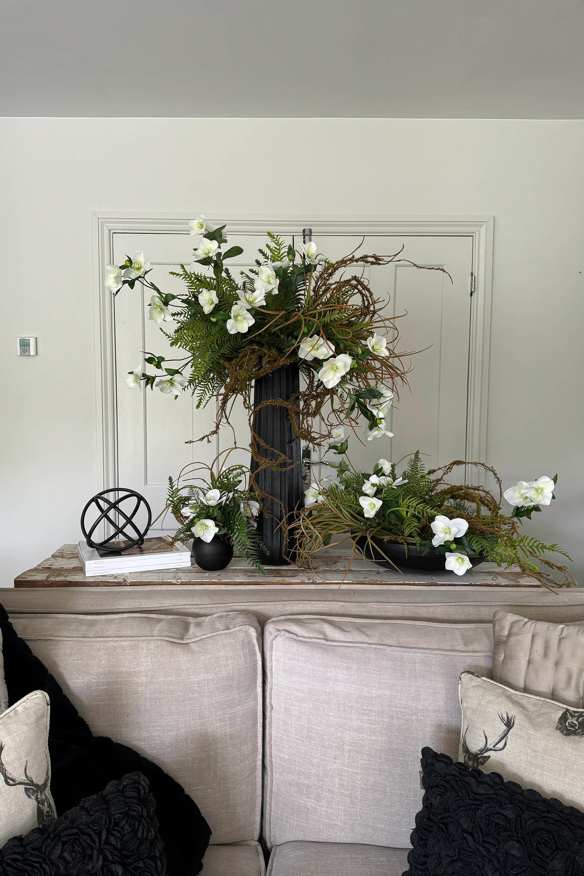 Hellebore, Ferns and Mossy Twig in a Black Ridged Vase RTfact Flowers 