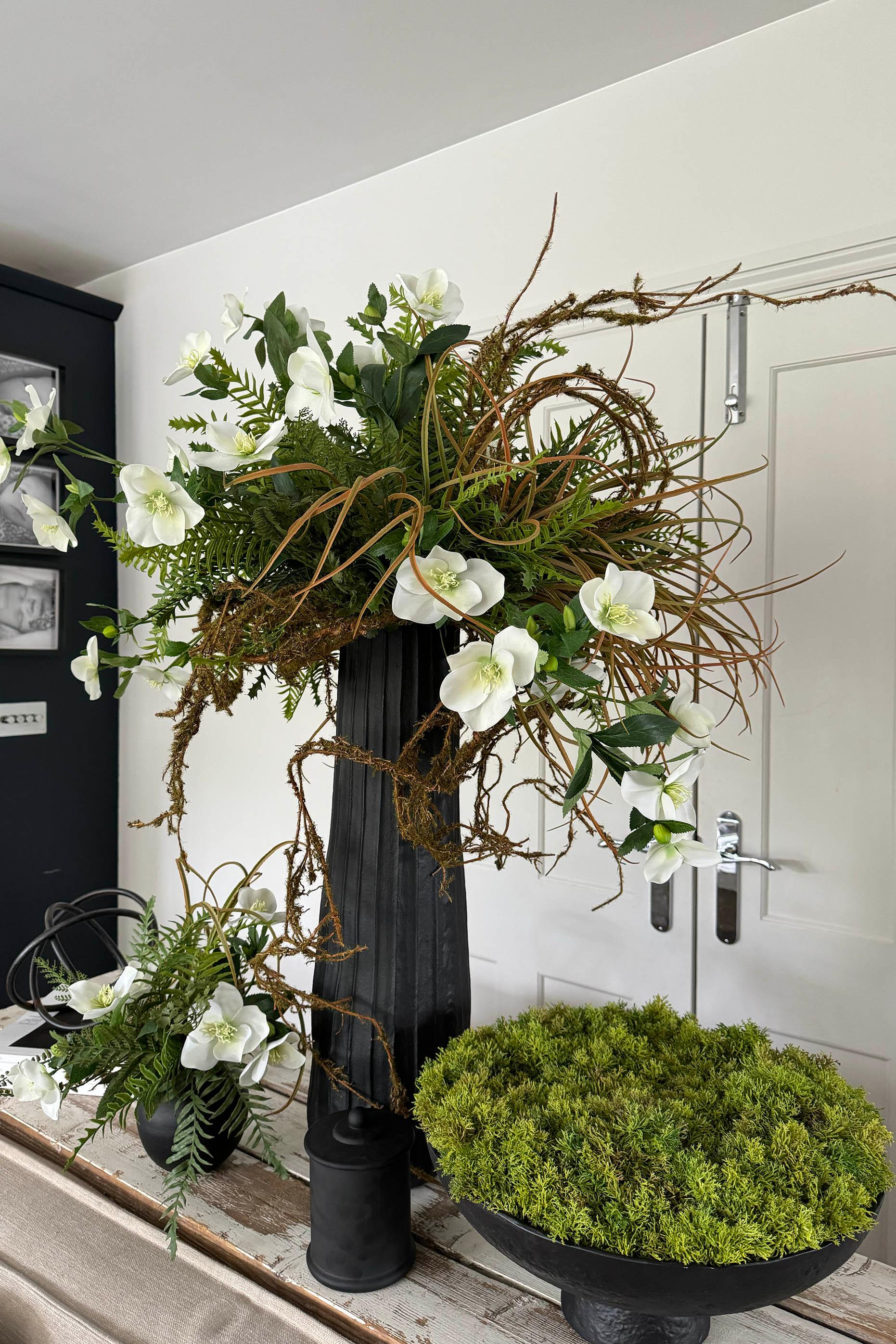 Hellebore, Ferns and Mossy Twig in a Black Ridged Vase RTfact Flowers 