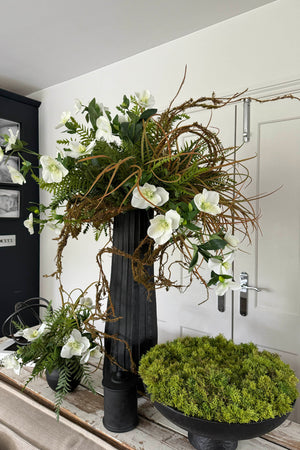 Hellebore, Ferns and Mossy Twig in a Black Ridged Vase