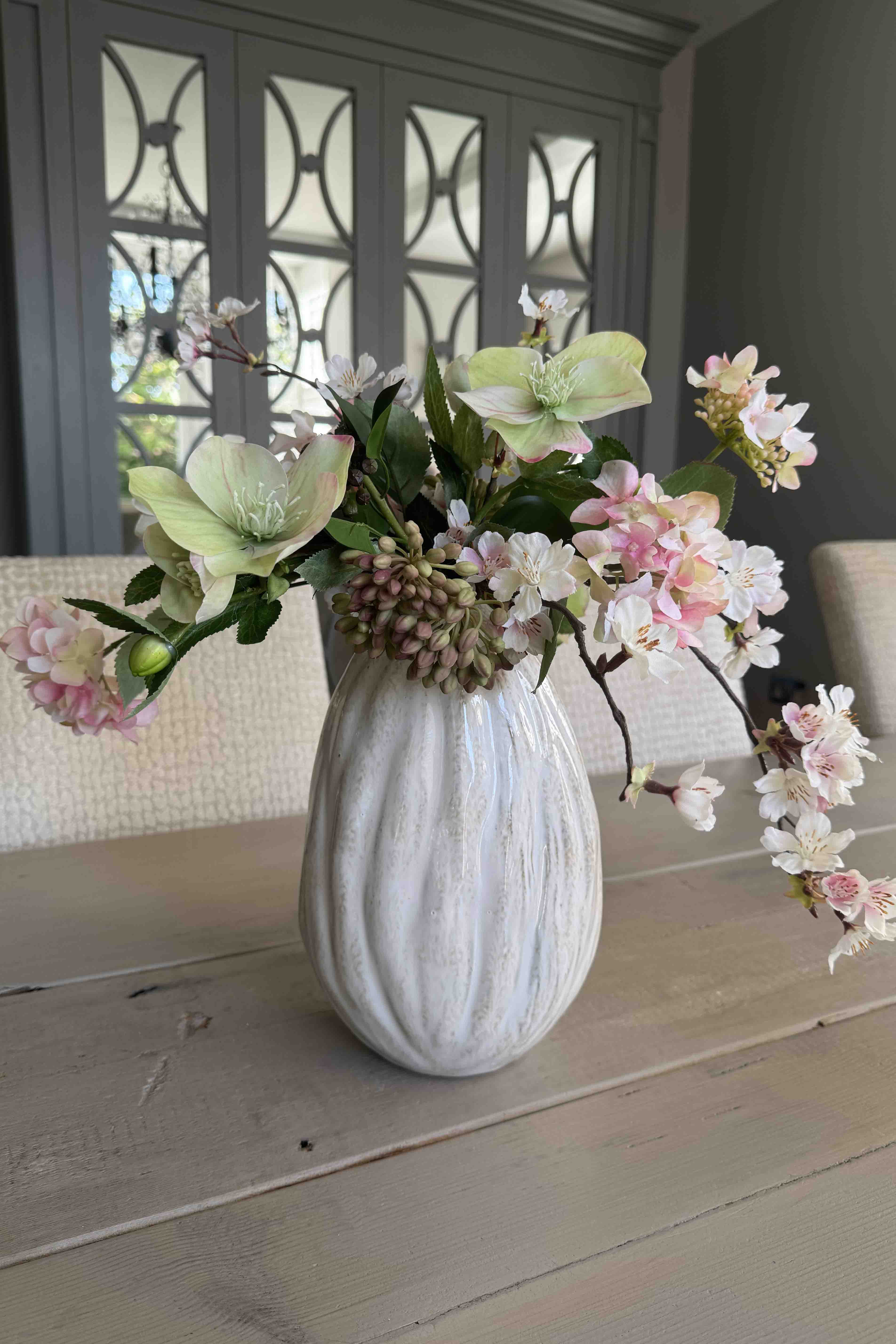Faux Flower Arrangement Blossom, Hellebore and Hydrangea in a Glazed Ceramic Vase. Rtfact