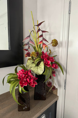 Heliconia and Orchids in Amber Glass Vases