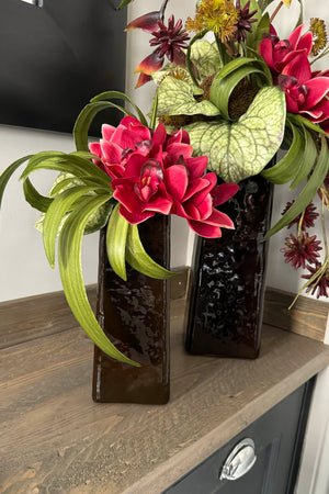 Heliconia and Orchids in Amber Glass Vases