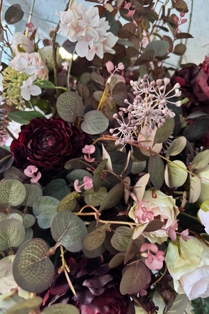 Eucalyptus, Rose and Ranunculus in a Ribbed Gold Metal Vase