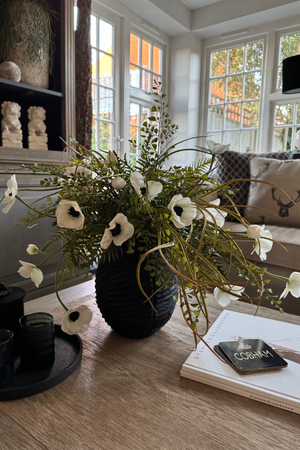 Anemone, Fern and Tillandsia Grass in a Black Ribbed Wooden Vase