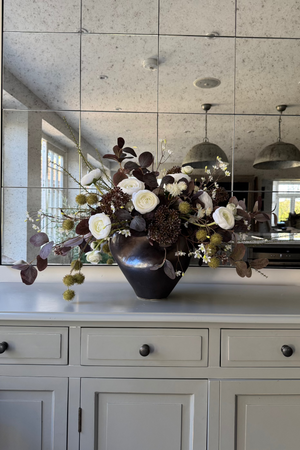 Ranunculus, Eucalyptus and Astrantia Spray in a Metallic Bronze Vase