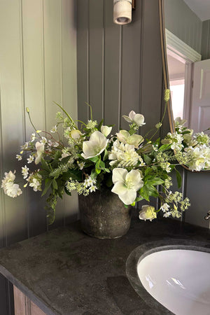 Hellebore, Bucida and Fern in a Dark Grey Stone Pot