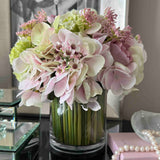 Hydrangea, Rose, Hellebore & Viburnum in a Stem Lined Cylinder (Pink)
