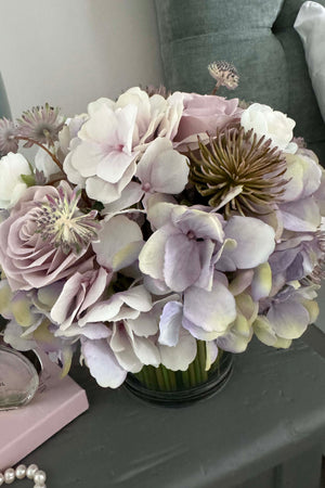 Hydrangea, Rose & Ranunculus in a Stem Lined Cylinder (Lilac)