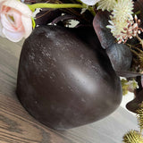 Ranunculus, Eucalyptus and Platanus in a Dark Brown Vase