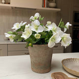 Faux flower bouquet plant on a kitchen counter with a neutral color scheme