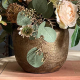 Rose, Echinops and Eucalyptus in a Bronze Vase