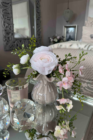 Ranunculus and Larksprum Spray in a Ribbed Glass Vase