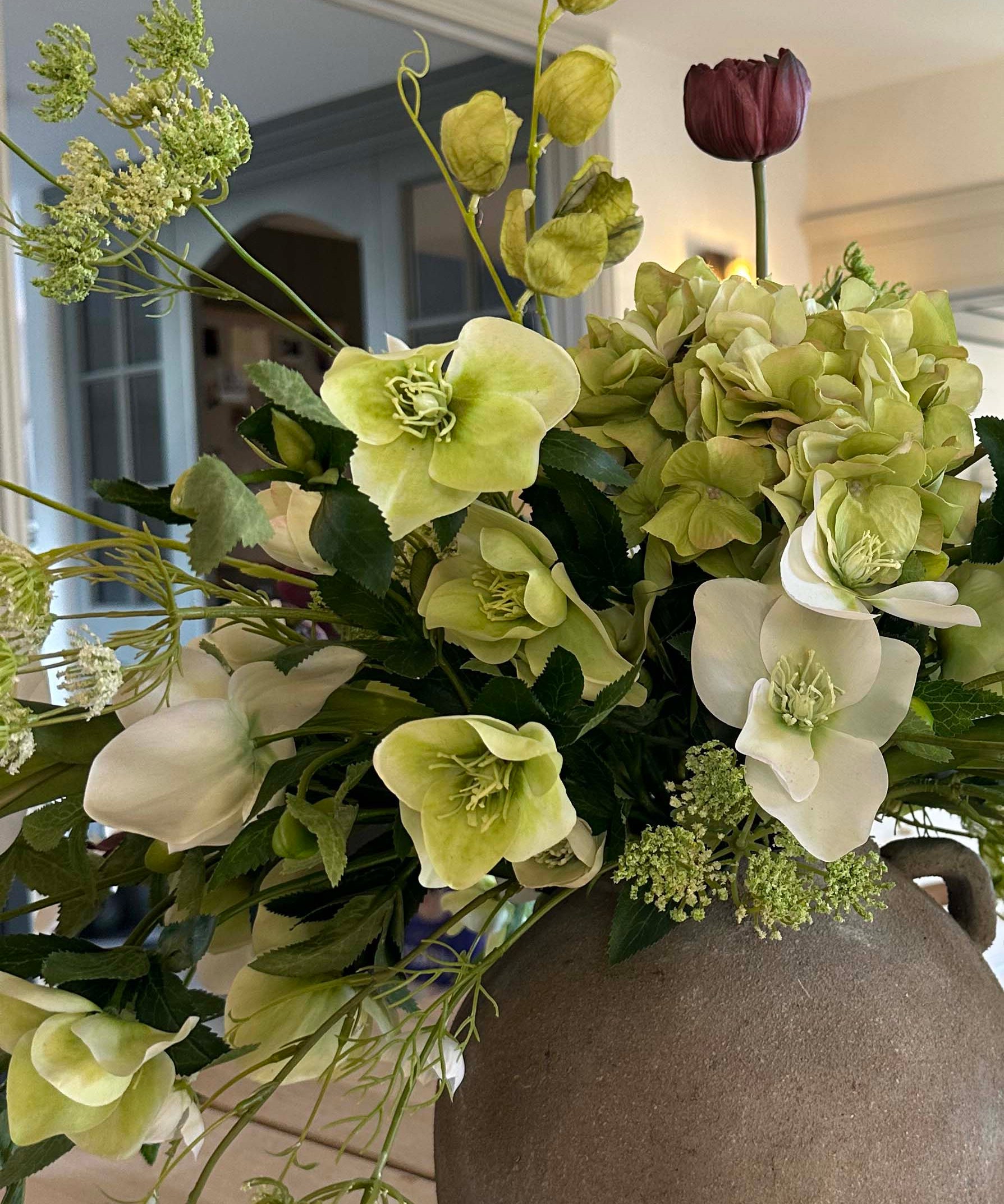 Hellebore, Tulips and Queen Anne's Lace in a Rustic Vase