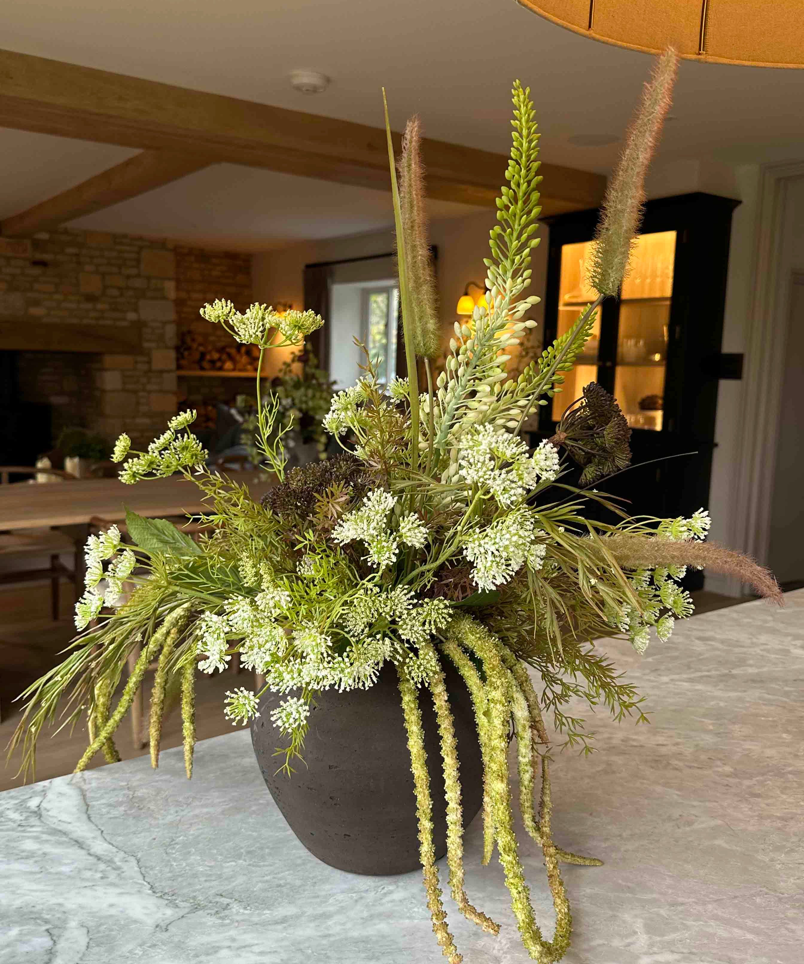 Angelica, Eremurus and Queen Anne's Lace in a Rustic Brown Vase