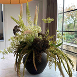Angelica, Eremurus and Queen Anne's Lace in a Rustic Brown Vase