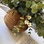 Wax Flower and Eucalyptus in a Carved Wooden Vase - to shoot RTfact Flowers 