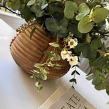 Wax Flower and Eucalyptus in a Carved Wooden Vase - to shoot RTfact Flowers 