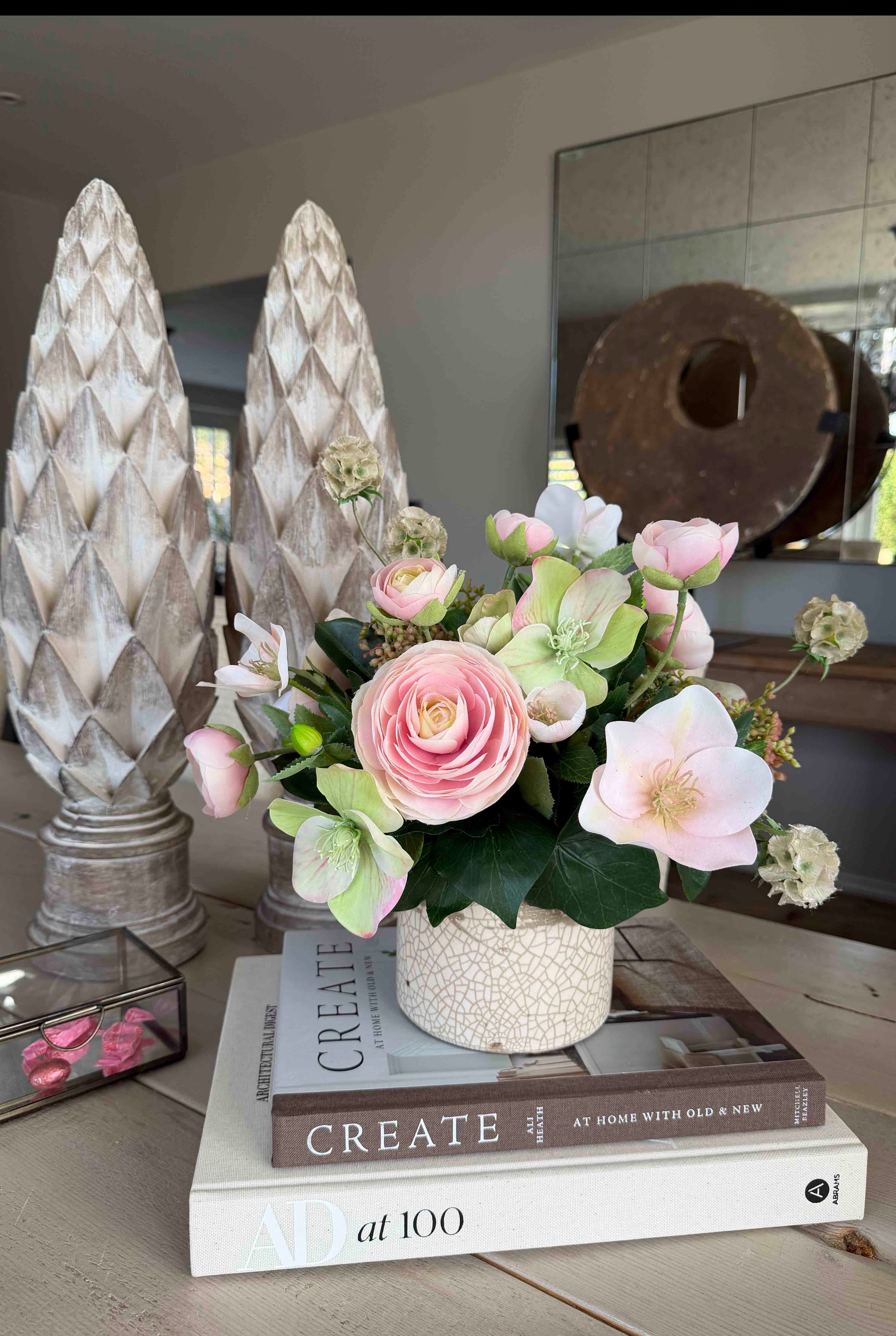 Ranunculus, Hellebores and Skimmia in a Cream Glazed Vase RTfact Flowers 
