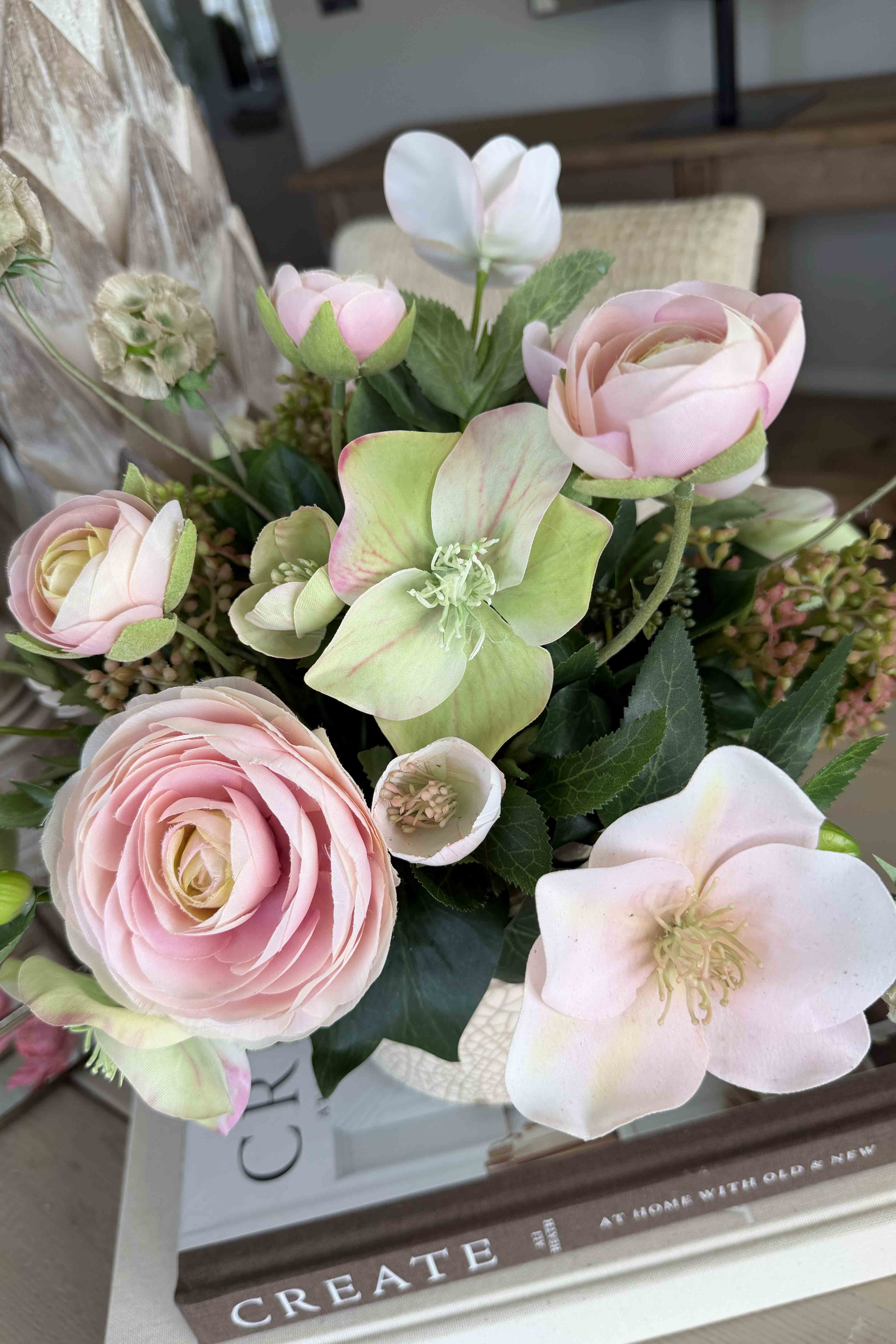 Ranunculus, Hellebores and Skimmia in a Cream Glazed Vase RTfact Flowers 
