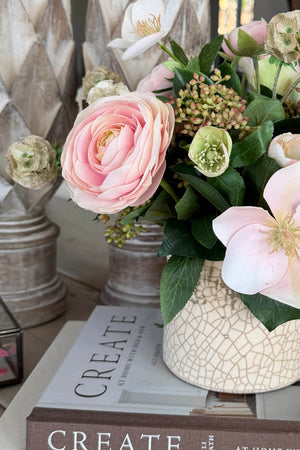 Ranunculus, Hellebores and Skimmia in a Cream Glazed Vase RTfact Flowers 