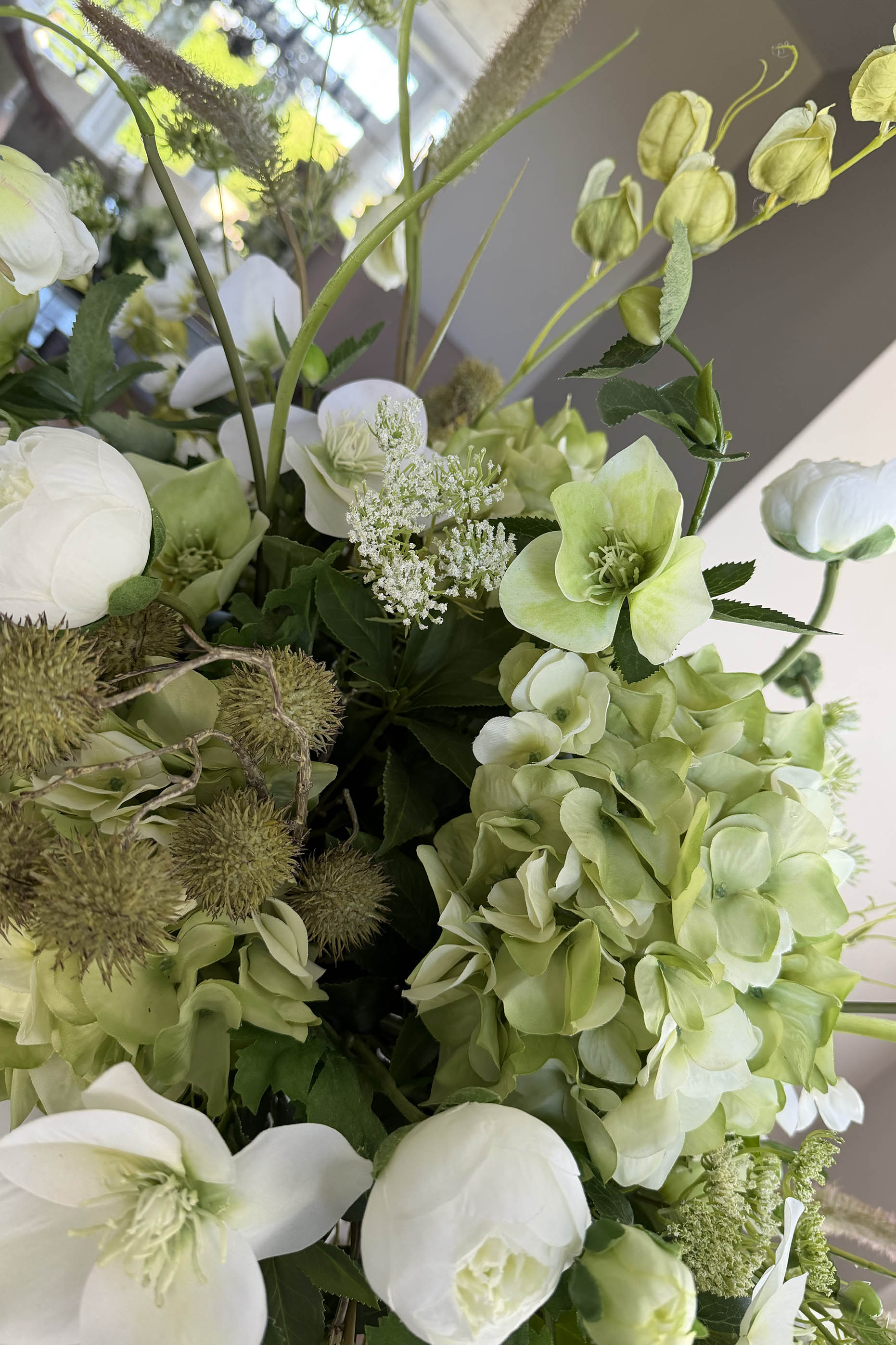 Bucida, Hellebores, Ranunuculus and Hydrangea in a White Matt Vase Rtfact Flowers 