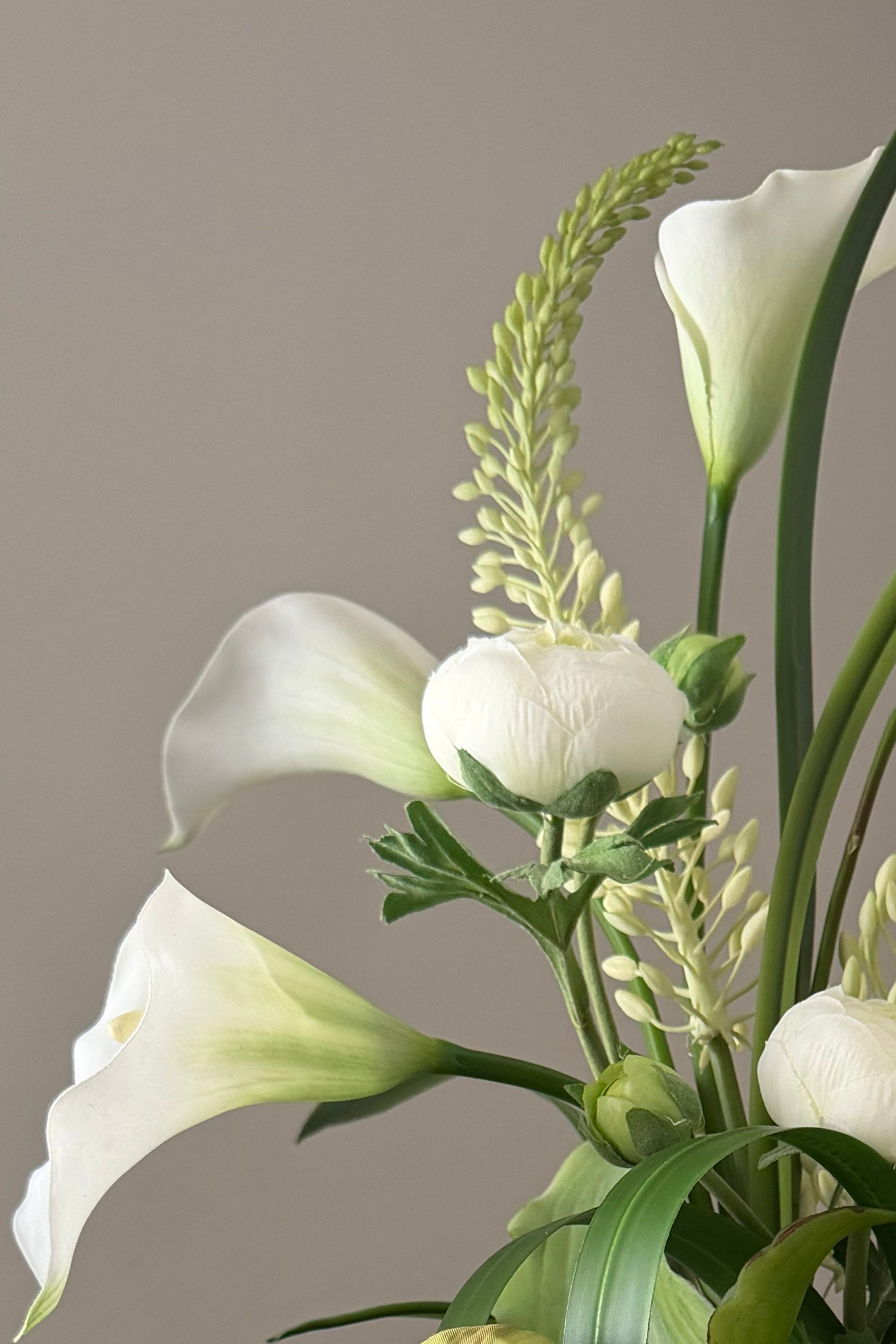 Calla Lily,Eremurus and Ranunculus in an Asymmetric Ribbed Vase RTFact Flowers 