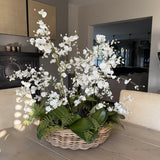 Dancing Orchids, Fern and Twigs in a Rattan Basket