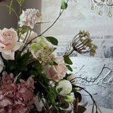 Eucalyptus, Roses, Hydrangeas and Ranunuculus in a Brown Stone Pot
