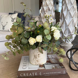 Hellebores, Eucalyptus, Roses and Hyacinth in a Stone Pot