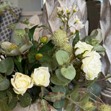 Hellebores, Eucalyptus, Roses and Hyacinth in a Stone Pot