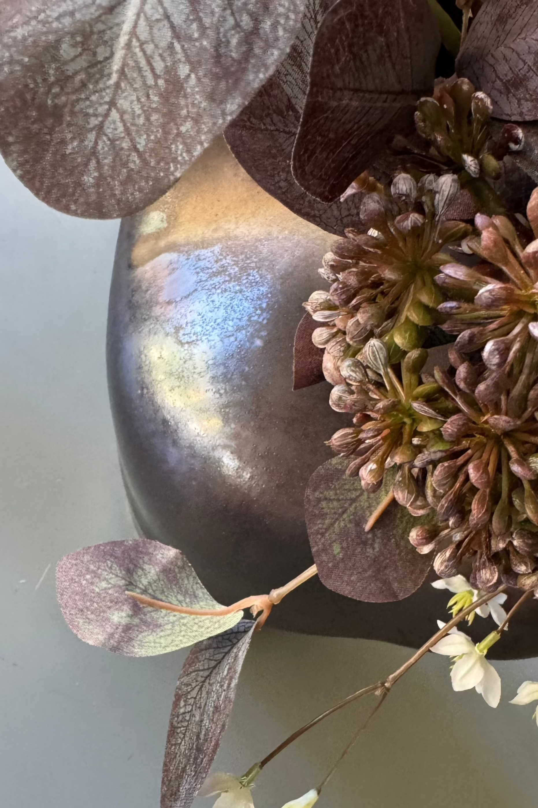 Ranunculus, Eucalyptus and Astrantia Spray in a Metallic Bronze Vase RTfact Flowers 