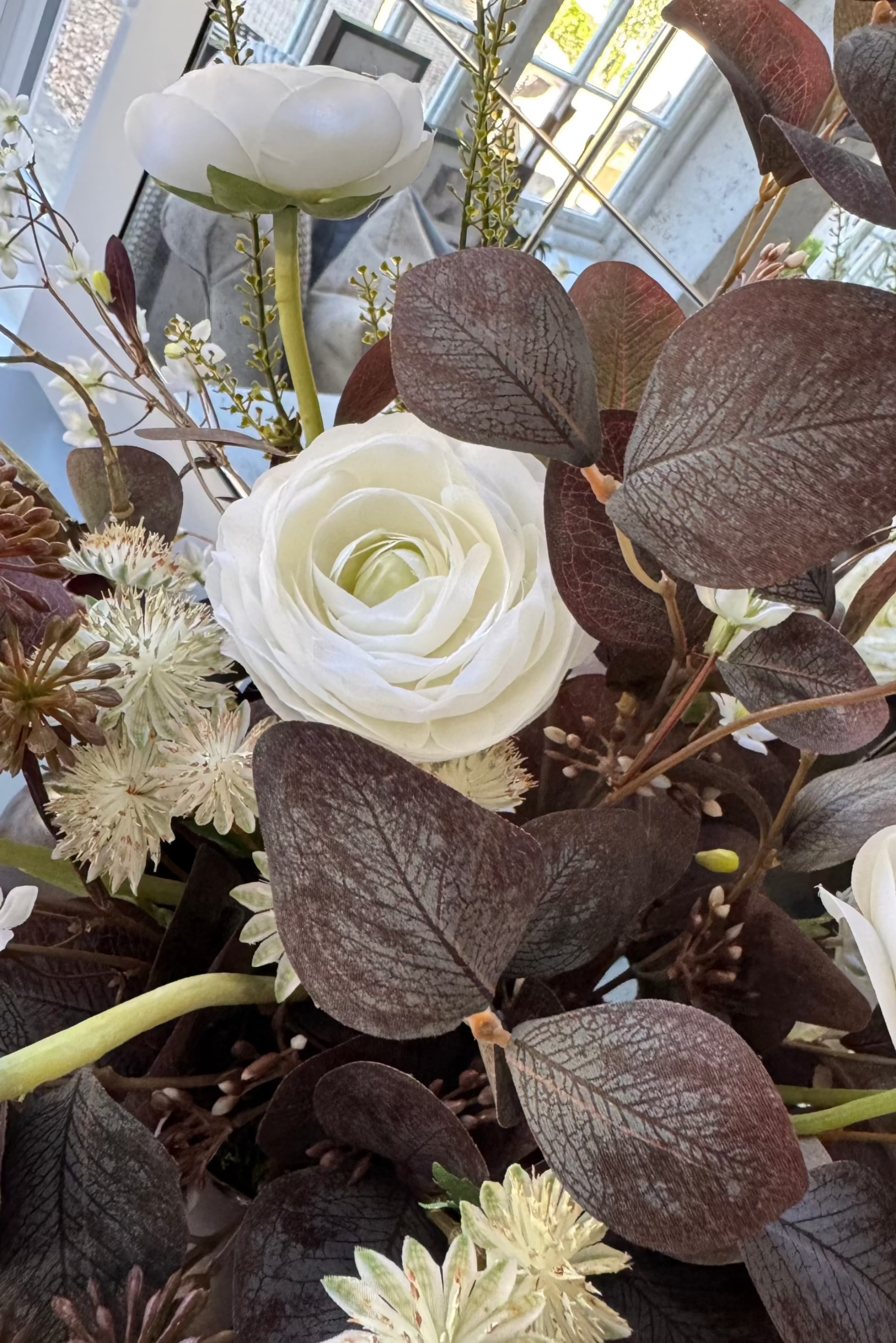 Ranunculus, Eucalyptus and Astrantia Spray in a Metallic Bronze Vase RTfact Flowers 