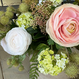 Ranunculus, Viburnum and Skimmia in a Taupe Glass Vase RTfact Flowers 