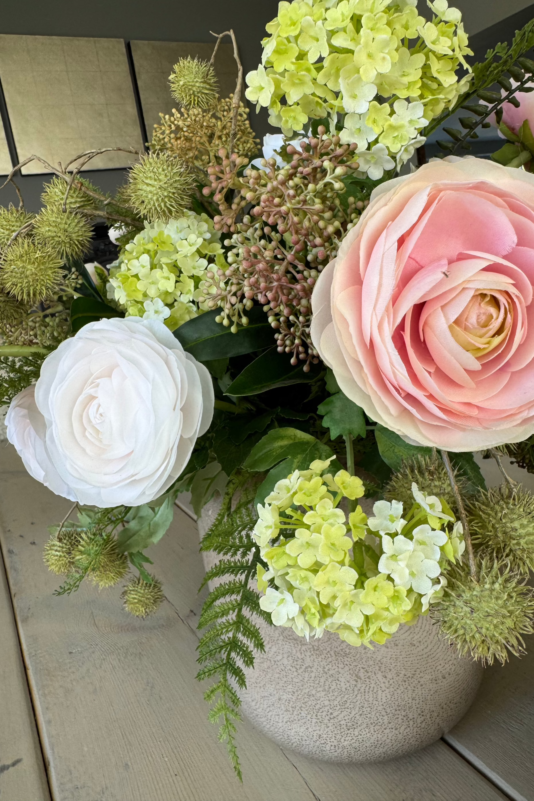 Ranunculus, Viburnum and Skimmia in a Taupe Glass Vase RTfact Flowers 