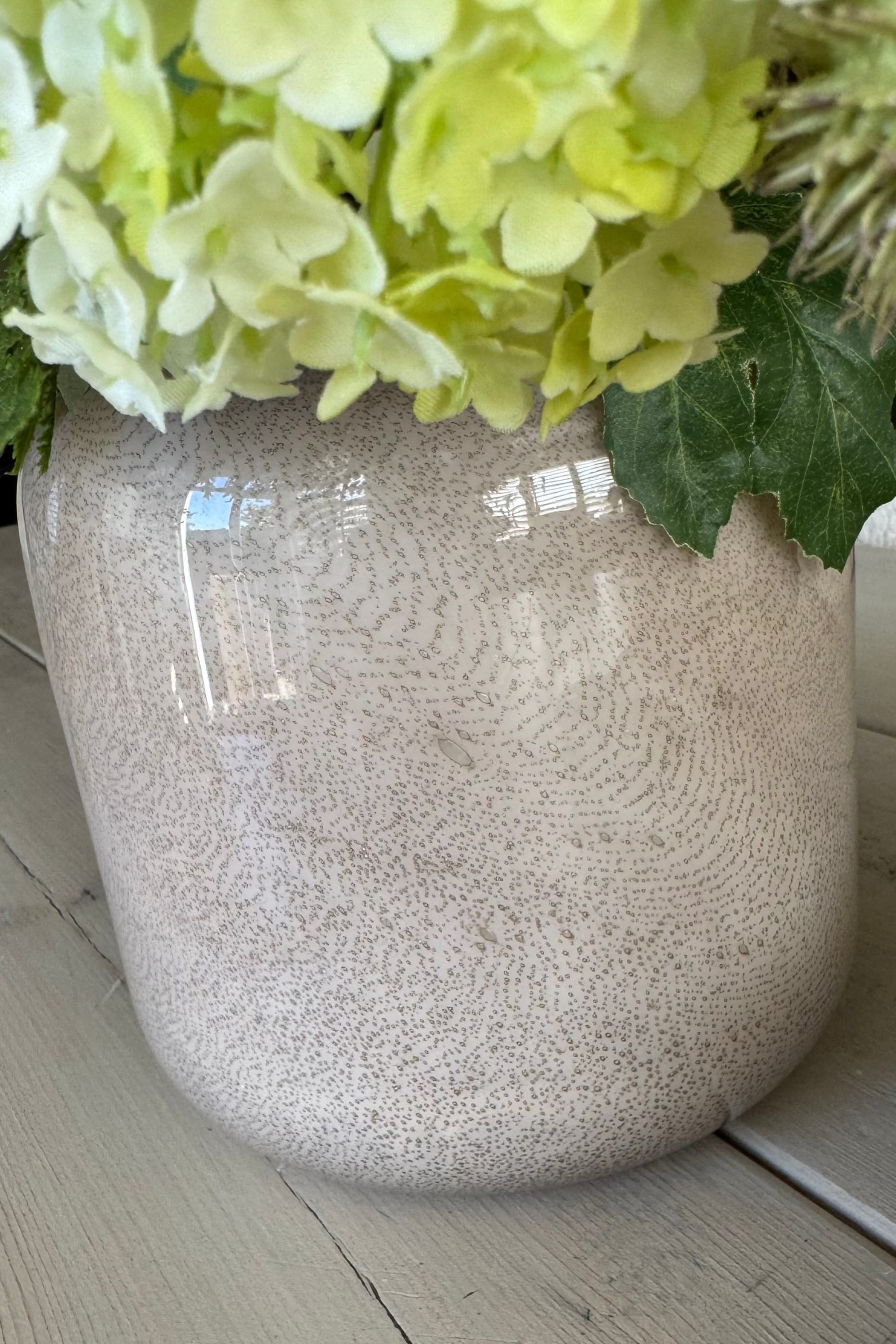 Ranunculus, Viburnum and Skimmia in a Taupe Glass Vase RTfact Flowers 