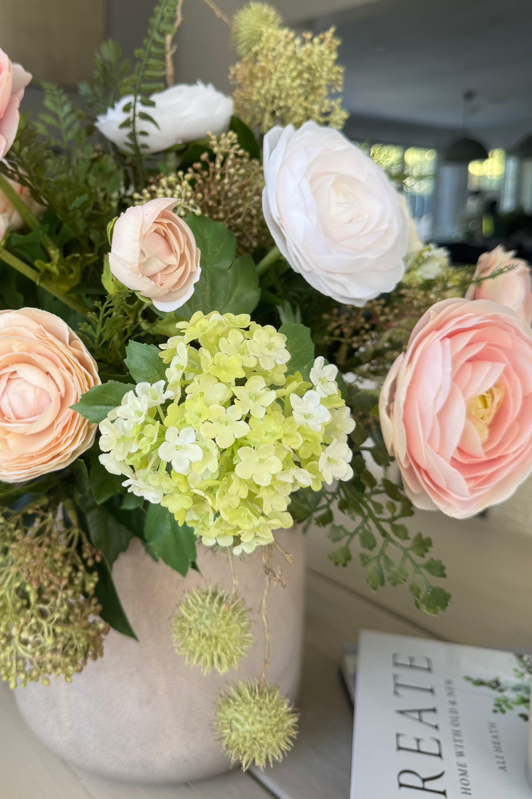 Ranunculus, Viburnum and Skimmia in a Taupe Glass Vase RTfact Flowers 