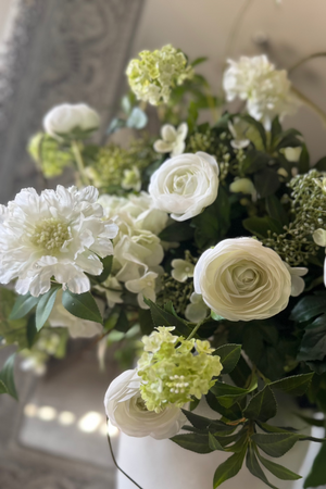 Ranunculus, Hydrangea and Viburnum in a Glazed White Vase